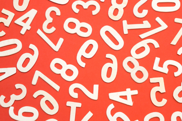 White numbers scattered on a vibrant red background.