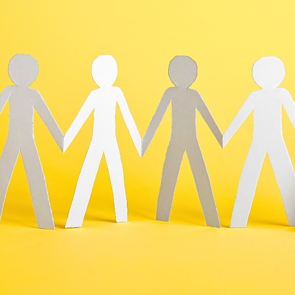 Four paper cut-out figures holding hands against a bright yellow background.
